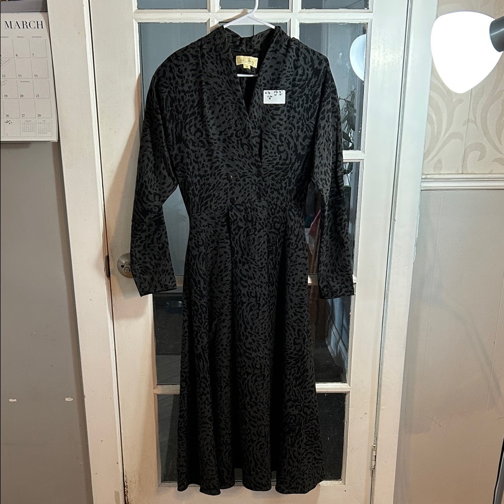 W76.    Vintage-Inspired Black Patterned Midi Dress